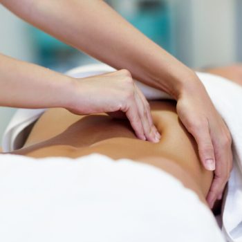 woman-having-abdomen-massage-by-professional-osteopathy-therapist