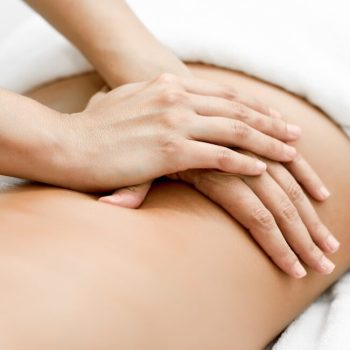 young-woman-receiving-back-massage-spa-center (1)